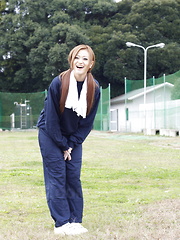 Long haired An Umemiya poses outdoor on field