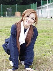 Long haired An Umemiya poses outdoor on field