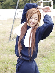 Long haired An Umemiya poses outdoor on field